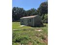 A detached shed in the backyard, providing additional storage space for equipment at 4922 Thonotosassa Rd, Plant City, FL 33565