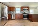 Bright kitchen with stainless steel refrigerator and appliances and ample counter space at 5141 Oakland Hills Ave, Sarasota, FL 34234
