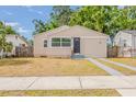 Charming single-story home with a well-maintained lawn and concrete driveway at 3944 11Th S Ave, St Petersburg, FL 33711