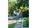 Scenic street view showcasing mature trees and partial water view beyond at 2309 S Ardson Pl # 1, Tampa, FL 33629