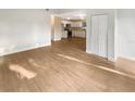 Bright, spacious living room featuring hardwood floors and an open layout with views to the kitchen at 1736 Taylor Lake Pl, Largo, FL 33778