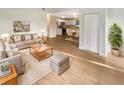 Bright and inviting living room with neutral tones and modern furnishings seamlessly connected to the kitchen at 1736 Taylor Lake Pl, Largo, FL 33778