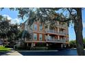 Multi-story condo building shows balconies and under building parking at 5000 Culbreath Key Way # 9-101, Tampa, FL 33611