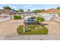 Cozy single-story home with a brick-paved driveway and well-maintained landscaping at 10227 Parsons St, Tampa, FL 33615