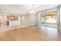 Spacious living room with access to a screened patio, seamlessly connecting indoor and outdoor living spaces at 11621 Ashton Field Ave, Riverview, FL 33579