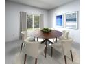 Bright dining room with a round table, comfortable seating, and stylish décor at 1799 Draughton Dr, Zephyrhills, FL 33541
