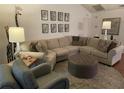 Comfortable living room with a large sectional sofa and decor at 420 S Brockfield Dr, Sun City Center, FL 33573