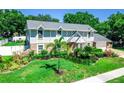 Beautifully landscaped home with mature trees and manicured lawn at 3009 Ridgevale Cir, Valrico, FL 33596
