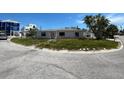 Charming single-story home featuring a classic design with a well-manicured lawn at 365 145Th E Ave, Madeira Beach, FL 33708
