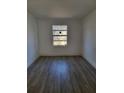 This simple bedroom has new vinyl flooring, is freshly painted and offers a spacious and simple design at 8612 N Alaska St, Tampa, FL 33604