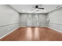 Large room with hardwood floors, and recessed lighting at 2731 Penzance St, Palm Harbor, FL 34684