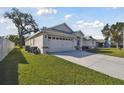 Lovely home with a spacious two-car garage, and a well-kept lawn at 3118 34Th Avenue E Dr, Bradenton, FL 34208