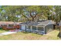 Inviting single-story home with a lovely covered porch, manicured lawn and one car garage at 7214 Oakwood Dr, New Port Richey, FL 34652