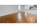 Spacious living room featuring hardwood floors and open layout at 10956 Carlton Fields Dr, Riverview, FL 33579