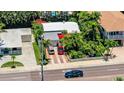 Charming home with a well-manicured yard, brick driveway, and ample parking at 16107 Gulf Blvd, Redington Beach, FL 33708