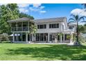 Expansive backyard with covered patio and fountain offers privacy and stunning views at 18620 Wayne Rd, Odessa, FL 33556