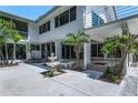 Private courtyard featuring a charming fountain and lush tropical landscaping at 18620 Wayne Rd, Odessa, FL 33556