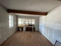 A living room featuring hardwood floors and a large window offering plenty of natural light at 432 2Nd Ne Ave, Largo, FL 33770