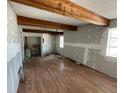 Spacious living room with hardwood floors and exposed wooden beams, offering unique character at 432 2Nd Ne Ave, Largo, FL 33770