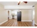 Open-concept living room showcases wood-look flooring and a seamless flow into other areas at 1020 58Th N Ave, St Petersburg, FL 33703