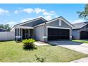 Beautifully landscaped front yard featuring a well-maintained lawn and inviting entrance at 12829 Kings Lake Dr, Gibsonton, FL 33534