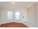 Open living area with bright windows and tile entry, seamlessly blending comfort and style at 11212 3Rd E Ave, Bradenton, FL 34212