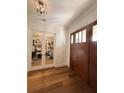 Welcoming foyer showcasing hardwood floors and a glimpse into a stylish living space at 4309 W Beachway Dr, Tampa, FL 33609
