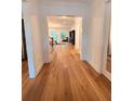Elegant hallway with hardwood floors leading to a bright and inviting living area at 4309 W Beachway Dr, Tampa, FL 33609