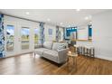 Comfortable living room featuring stylish decor and view of the lake at 265 Seahorse Se Dr # B, St Petersburg, FL 33705
