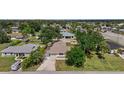 Aerial view of the home showing its position within a tree-filled neighborhood at 2126 Hanby St, Port Charlotte, FL 33952