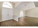 Welcoming entryway boasting wood floors, soaring ceilings and double front doors at 4266 Candler Ave, Spring Hill, FL 34609