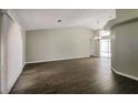 Spacious living room with hardwood floors and ample natural light from large window at 4266 Candler Ave, Spring Hill, FL 34609