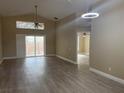 Bright living room with vaulted ceilings and sliding glass doors leading to outdoor space at 12421 Early Run Ln, Riverview, FL 33578