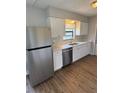 Bright kitchen with stainless steel appliances, white cabinets, and modern countertops at 845 18Th S Ave, St Petersburg, FL 33705