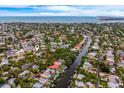 Stunning aerial view of waterfront homes, showcasing a neighborhood with private docks and access to the ocean at 5108 Saint Albans Ave, Siesta Key, FL 34242