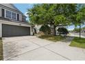 Well-maintained townhome with a spacious driveway and lush landscaping, enhancing curb appeal at 10124 Westpark Preserve Blvd, Tampa, FL 33625
