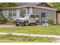 Exterior view of a cozy home with unique lattice siding and a well-maintained lawn at 15272 Avalon Ave, Clearwater, FL 33760