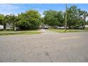 A street view showcasing the home's front yard and multiple parked cars at 15272 Avalon Ave, Clearwater, FL 33760