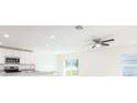 Bright kitchen featuring granite countertops, stainless steel appliances, and a view to the backyard at 23461 Wickens Ave, Port Charlotte, FL 33980