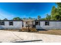 Charming home with a well-maintained yard and inviting front porch at 5907 Sussex Ct, Tampa, FL 33615