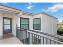 Charming condo exterior with a welcoming entrance door and bronze window frames at 6210 Sun Blvd # 206, St Petersburg, FL 33715