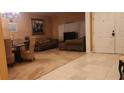 Cozy living room featuring tile and carpet flooring, comfortable seating and ample natural light at 1829 Mira Lago Cir, Ruskin, FL 33570