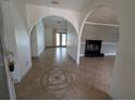Inviting entryway featuring arched doorways, tile flooring, and decorative accents throughout the open floor plan at 141 Angol St, Punta Gorda, FL 33983