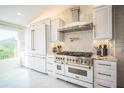 Modern kitchen featuring stainless steel appliances, granite countertops, and ample cabinet space at 328 6Th Ave, Indian Rocks Beach, FL 33785
