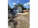 The house has a backyard with a wood privacy fence and shed at 5015 N 29Th St, Tampa, FL 33610