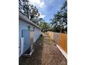 The home features a spacious side yard with a privacy fence and new AC unit at 5015 N 29Th St, Tampa, FL 33610