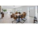 Inviting dining room with stylish furniture, seamlessly flowing into the bright and airy living space at 3528 Casablanca Ave, St Petersburg, FL 33706