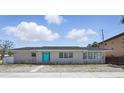 Charming home featuring a bright blue door and well-maintained landscaping, creating a welcoming curb appeal at 3528 Casablanca Ave, St Petersburg, FL 33706