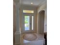 Welcoming front entrance with glass double doors and transom window for added natural light at 10937 Bluestem Cir, Lakewood Ranch, FL 34202