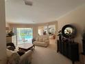 Living area with comfortable seating, access to the pool, and a view of the backyard at 10937 Bluestem Cir, Lakewood Ranch, FL 34202